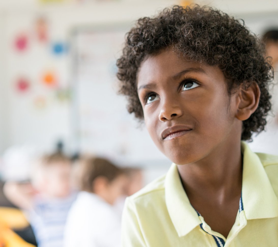 Portrait of a thoughtful African American boy at school